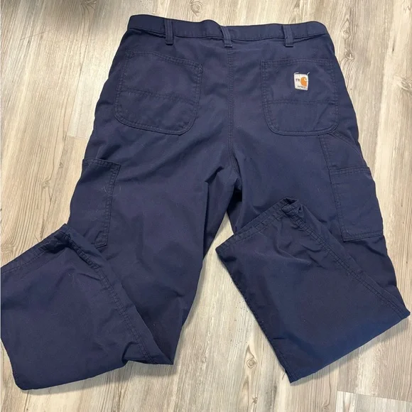 Durable Carhartt FR flame-resistant work pants in navy. Size 34x30.